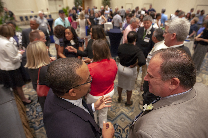 Maryland State Bar Association members mingling at a networking event in a ballroom.